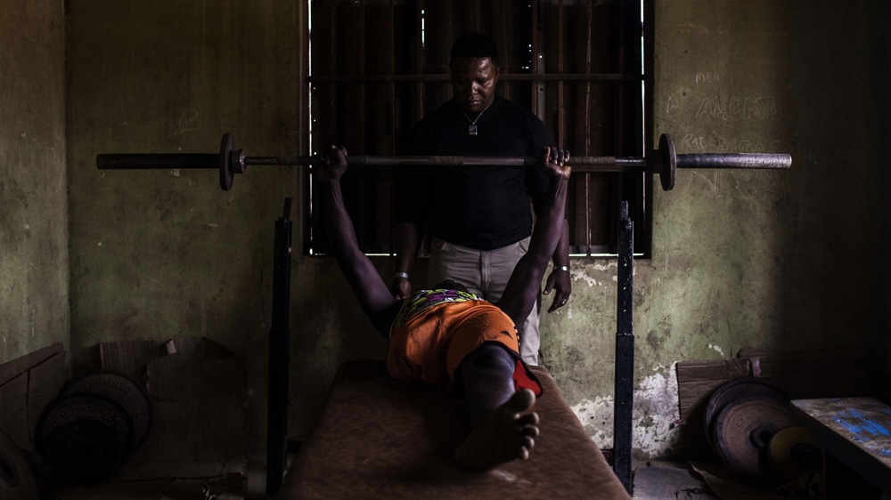 A polio survivor lifts weights in the small gym where the para-soccer players work out [Diego Ibarra Sanchez/MeMo] 
