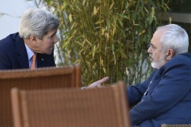 US Secretary of State John Kerry talks with Iranian Foreign Minister Mohammad Javad Zarif, in Geneva, Switzerland [AP]