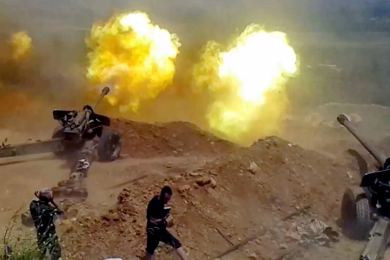 Syrian army soldiers during a artillery operations in al-Zabadani area