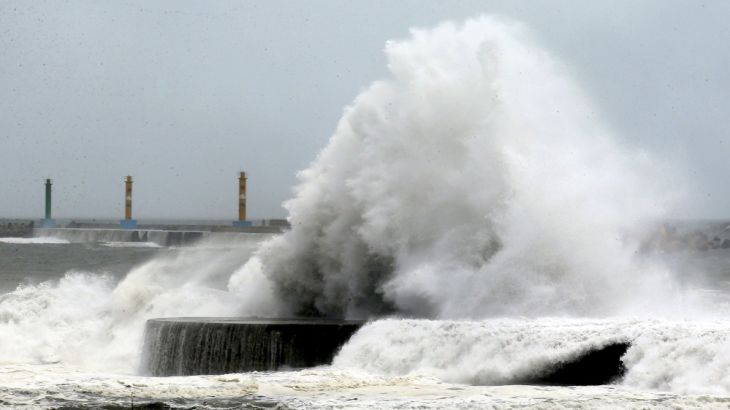 Big waves are seen as Typhoon Soudelor approaches the northeastern coastal town of Nanfangao in Ilan county