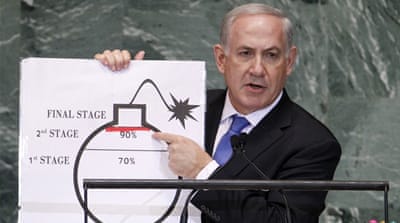 Netanyahu points to a graphic of a bomb as he addresses the 67th United Nations General Assembly at the UN headquarters in New York in 2012 [Reuters]