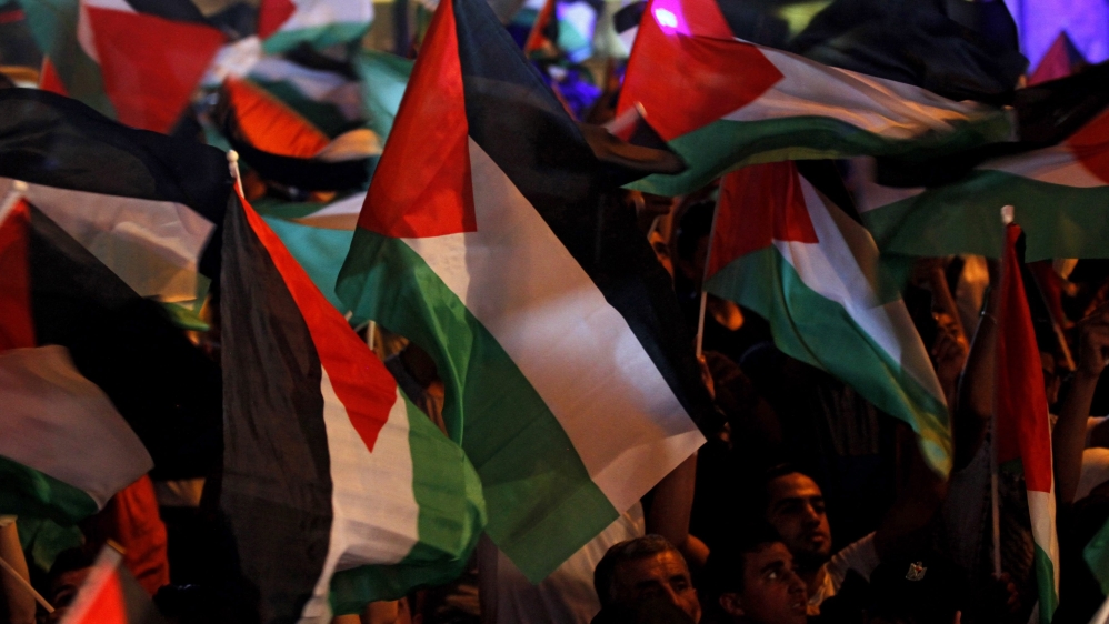 Palestinians celebrated in the West Bank city of Ramallah as the Palestinian flag was raised at the United Nations for the first time in history [EPA]