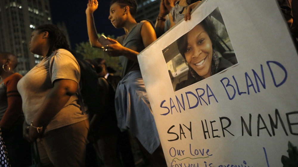 A demonstrator holds a Sandra Bland sign during a vigil on July 28, 2015 [AP/Christian K. Lee] [Daylife]