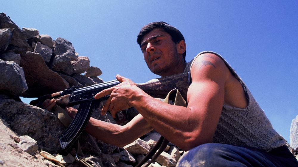 The soldier in this image informed me that he had just hit his target. The silence from the enemy trench seemed to add validity to his claim. The trench warfare of the Nagorno-Karabakh War bore similarities to the First World War. 1992 [Jack Picone] 