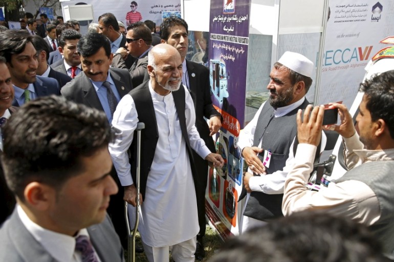 Ghani talks to participants at an exhibition of Afghanistan products during the Regional Economic Cooperation Conference of Afghanistan (RECCA) in Kabul, Afghanistan September 4 [REUTERS]