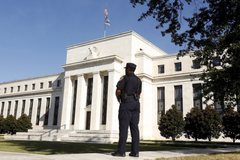 Police officer keeps watch at the The Federal Reserve in Washington
