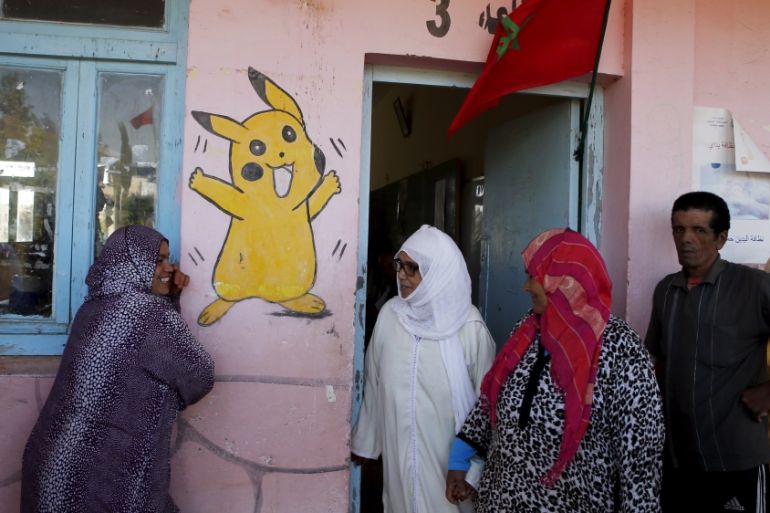 People wait to vote at a polling station in the town of Tifelt, east of Rabat, Morocco