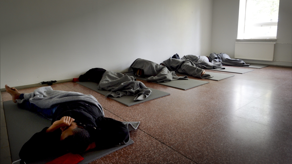 Refugees sleep after Thursday night's attack by a group of far-right activists [AP]