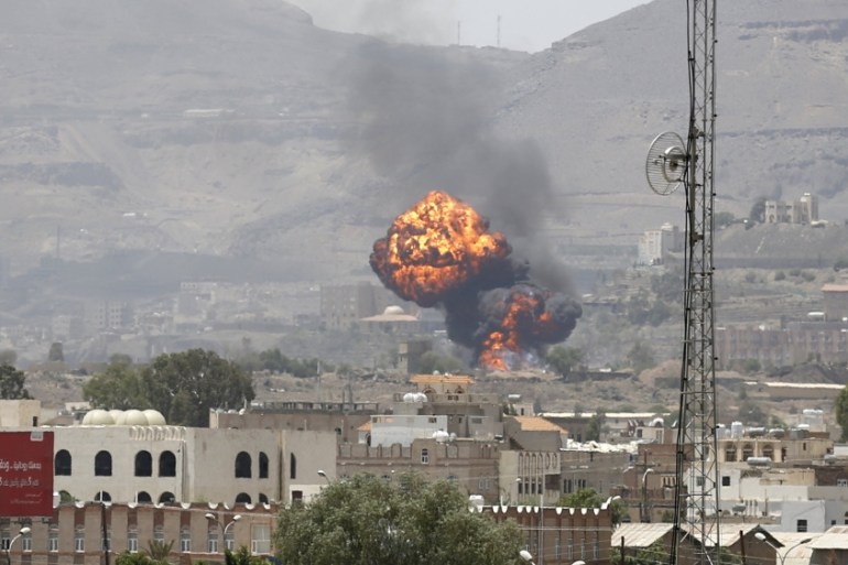 Smoke and balls of fire rise from a military base after it was hit by Saudi-led air strikes in Yemen''s capital Sanaa