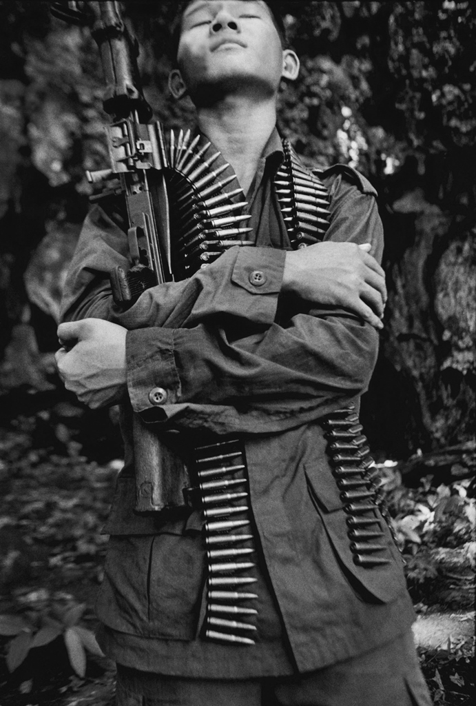 We were on our way to an ambush in the jungle on the Thai-Myanmar border when I noticed this KNLA combatant flinch with pain. A little later, I asked him what the problem was. He told me 'malaria'. 2006 [Jack Picone] 