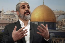 Hamas leader Khaled Meshaal speaks during an interview with Reuters in Doha