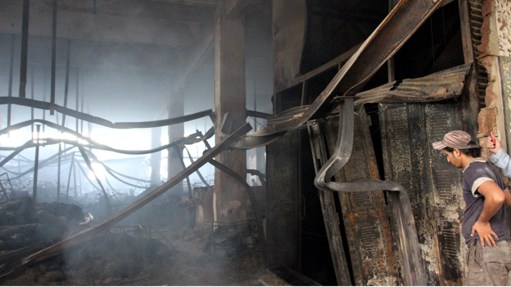 The factory fire in 2012 killed at least 289 Pakistani workers in Karachi [Rehan Khan/EPA] 