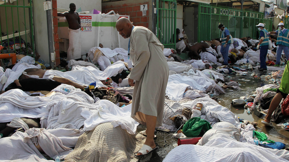 Pilgrims walked amid the bodies of some of those killed in the stampede in the Mina neighbourhood of Mecca [EPA]