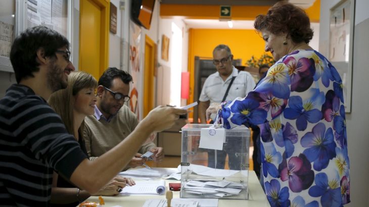 A woman casts her ballot during a regional parliamentary election in Barcelona