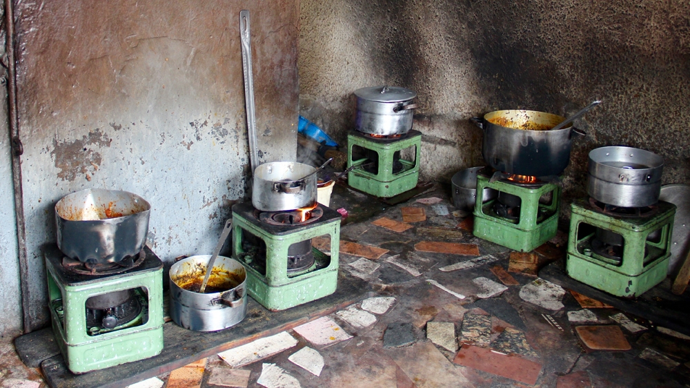 All the cooking at Appetite Delight is done on six kerosene stoves [Femke van Zeijil/Al Jazeera]