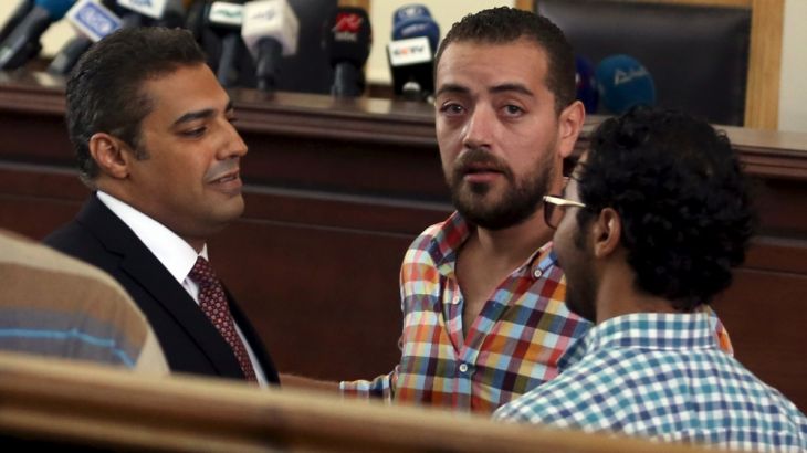 Fahmy and Mohamed talk before hearing the verdict at a court in Cairo