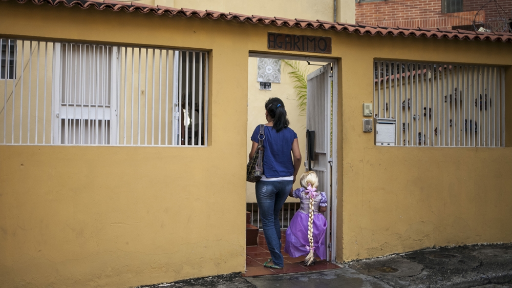 It's an hour-long journey to daycare for Carla and Sofia, after which Carla must make her way to work [Santi Donaire/Al Jazeera] 