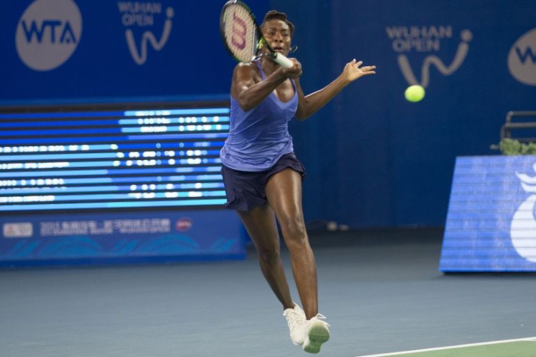 Venus Williams plays against Agnieszka Radwanska during their women''s singles match at the Wuhan Open tennis tournament