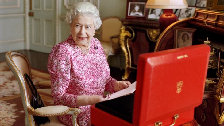 A handout photograph shows Britain''s Queen Elizabeth sitting in her private audience room in Buckingham Palace next to one of her official red boxes in London
