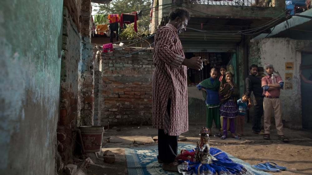 The Delhi slum of Kathputli Colony has long been home to street performers and artists [Joshua Cogan]