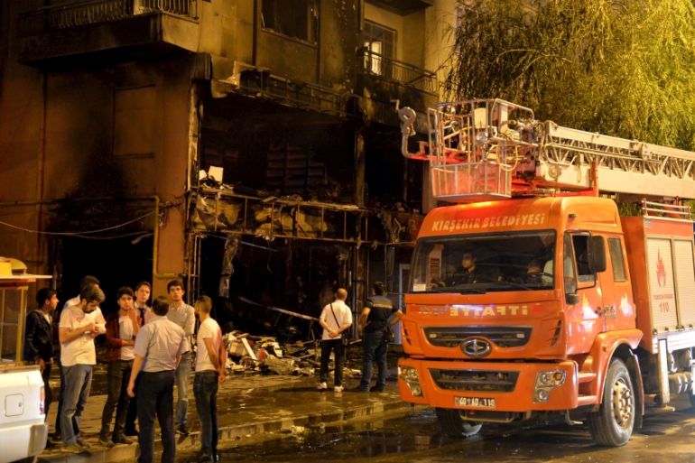 A firebrigade truck is parked outside a damaged bookstore after it was set on fire by ultra nationalist protesters in Kirsehir,Turkey