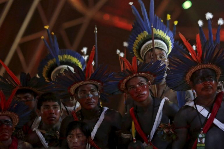 Indigenous people of several tribes watch a presentation by Indigenous people from Kuikuro before the I World Games for Indigenous People in Palmas