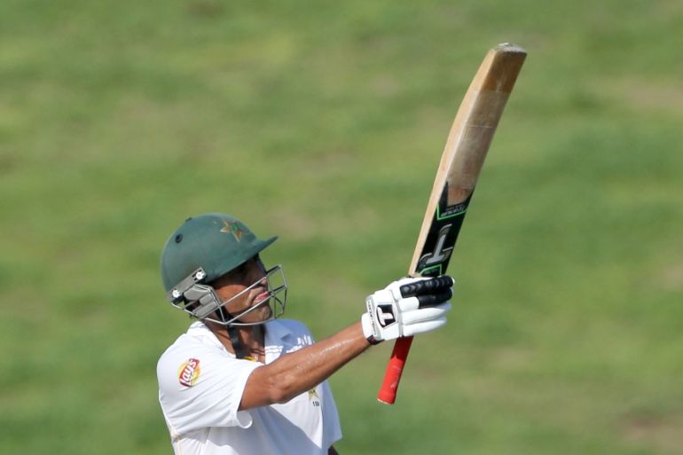Pakistan''s Younis Khan raises his bat after becoming Pakistan''s leading test run scorer