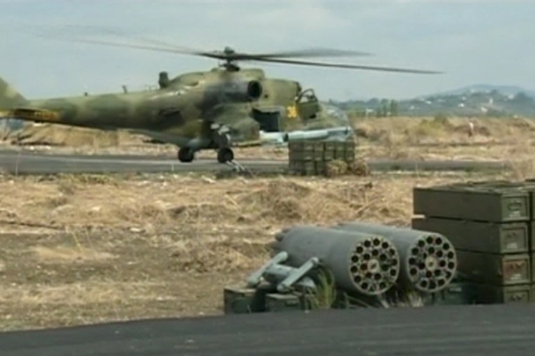 A still image shows a Russian air force helicopter on the tarmac of Heymim air base near the Syrian port town of Latakia