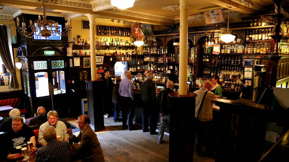 The Pot Still in Glasgow, Scotland has been a bar since the late 1800s and it’s a good place to get an introduction to Scotch whisky [File: Michelle Locke/The Associated Press]