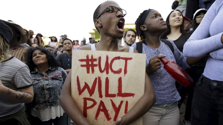 Students protest during a mass demonstration on the steps of Jameson Hall at the University of Cape Town