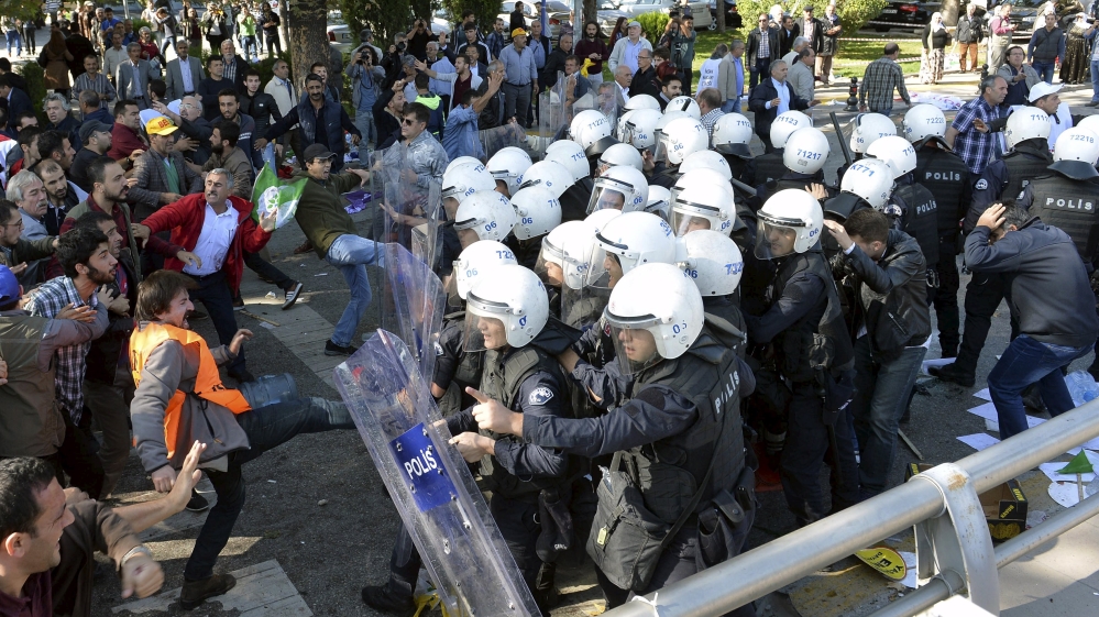 Demonstrators confront riot police following the deadly explosions [Reuters]