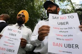 Taxi drivers attend an Uber protest