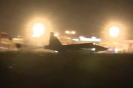 Frame grab shows a Russian military jet taxiing on runway shortly after the landing in Syria