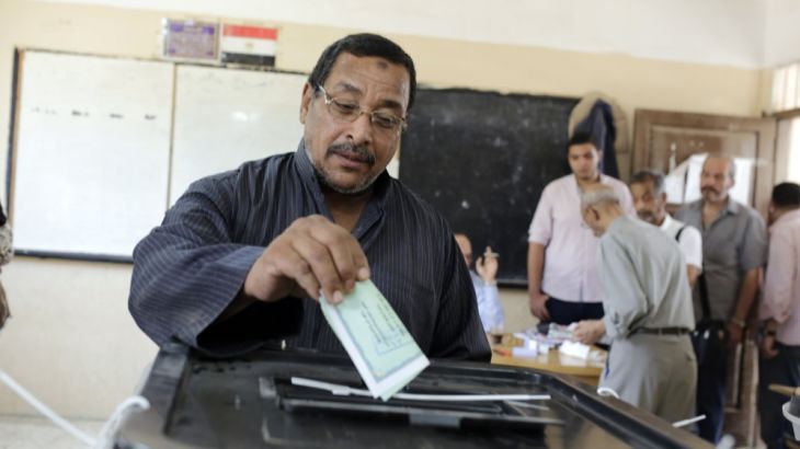 An Egyptian voter casts his ballot