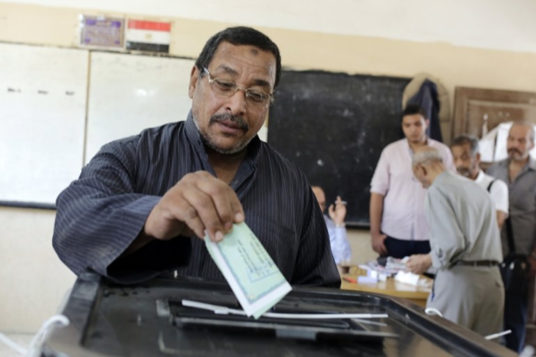 An Egyptian voter casts his ballot