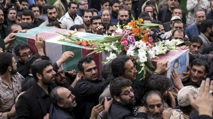 Mourners carry the coffin of Amin Karimi, a member of Iranian Revolutionary Guards who was killed in Syria, during his funeral in Tehran