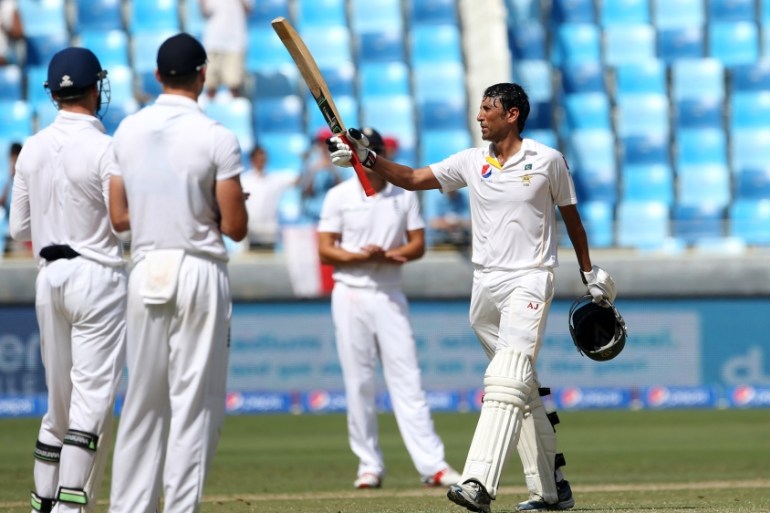 Pakistan''s Younis Khan (R) celebrates scoring a century