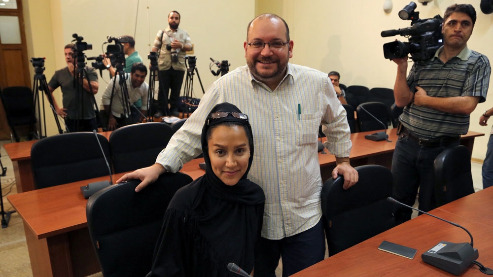 Rezaian, seen here with his wife, was tried in four hearings behind closed doors, the last of which was held in August [EPA]