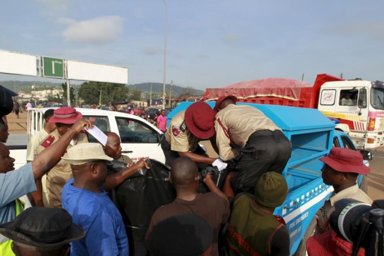 The body of one of the victims of the Nyanya bomb blast is loaded onto a truck in Abuja