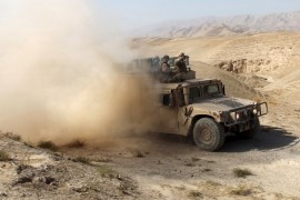 An Afghan security vehicle advances towards Kunduz, Afghanistan