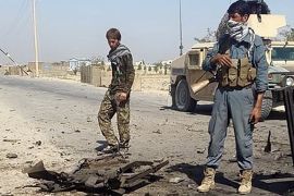 Afghanistan''s security forces inspect the site of a U.S. airstrike, in Kunduz city