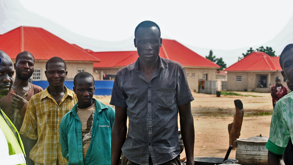 Kabiru (centre) has repeatedly fled Boko Haram attacks in Nigeria, Chad, and Niger [Fragkiska Megaloudi/Al Jazeera]