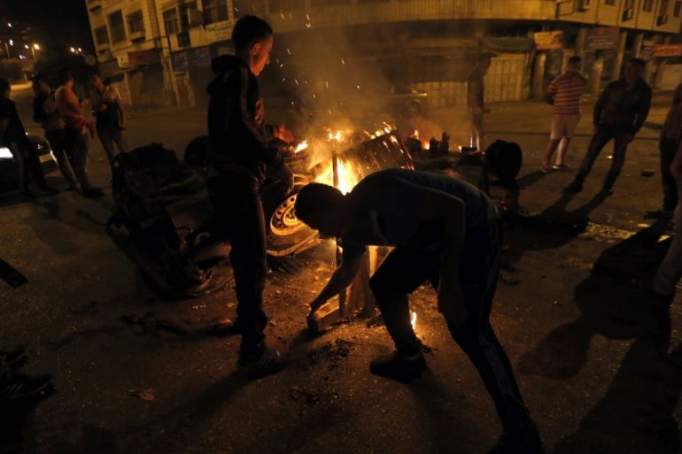 Palestinians set ablaze an Israeli settlers car in Nablus, the West Bank