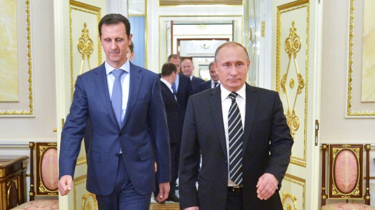 Russian President Vladimir Putin and Syria President Bashar al-Assad arrive for their meeting in the Kremlin in Moscow [AP]
