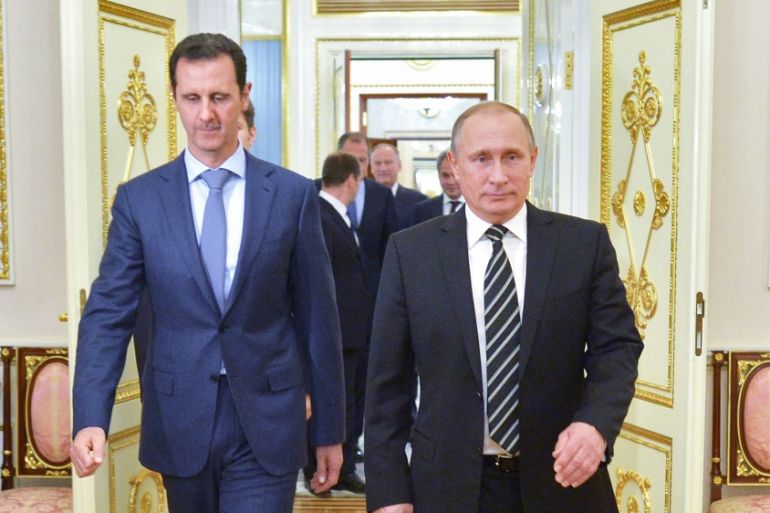 Russian President Vladimir Putin and Syria President Bashar al-Assad arrive for their meeting in the Kremlin in Moscow [AP]