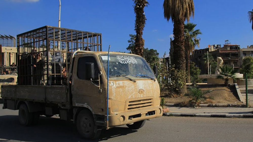 Jaish al-Islam drives caged prisoners through Douma and Eastern Ghouta as an attempt to deter government air strikes on the towns [Al Jazeera]