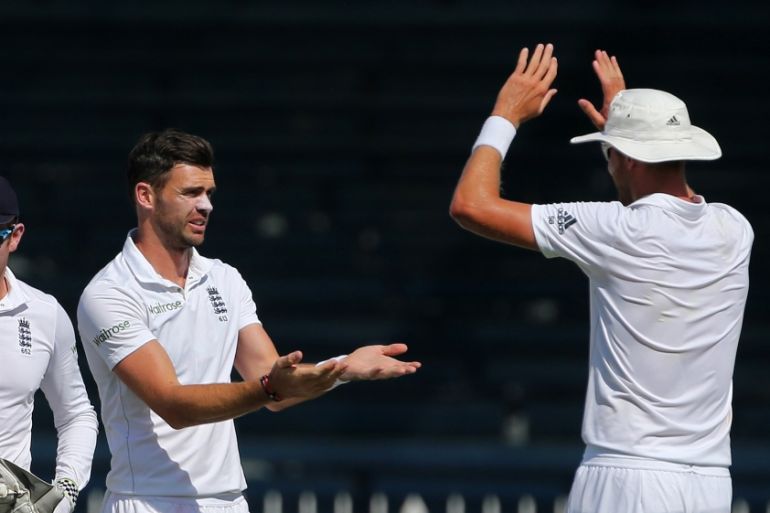England''s James Anderson (2nd L) celebrates taking the wicket of Younis Khan (not pictured)
