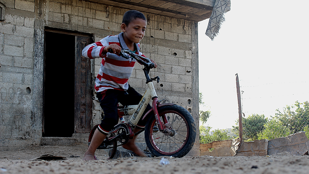 The bike has only one tyre but that simply makes riding it even more fun for Jihad [Matthew Vickery/Al Jazeera]