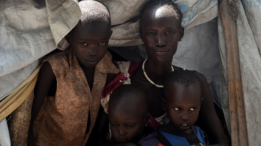 Martha Nyamai says she kept her children alive by holding them under water while government forces sprayed rounds into the swamps where they hid [Jason Patinkin/Al Jazeera]