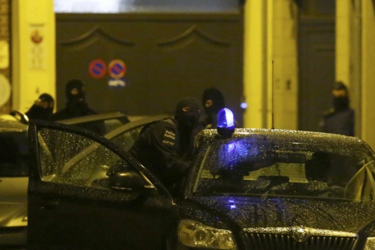 Belgian police stage a raid, in search of suspected muslim fundamentalists linked to the deadly attacks in Paris, in the Brussels suburb of Molenbeek